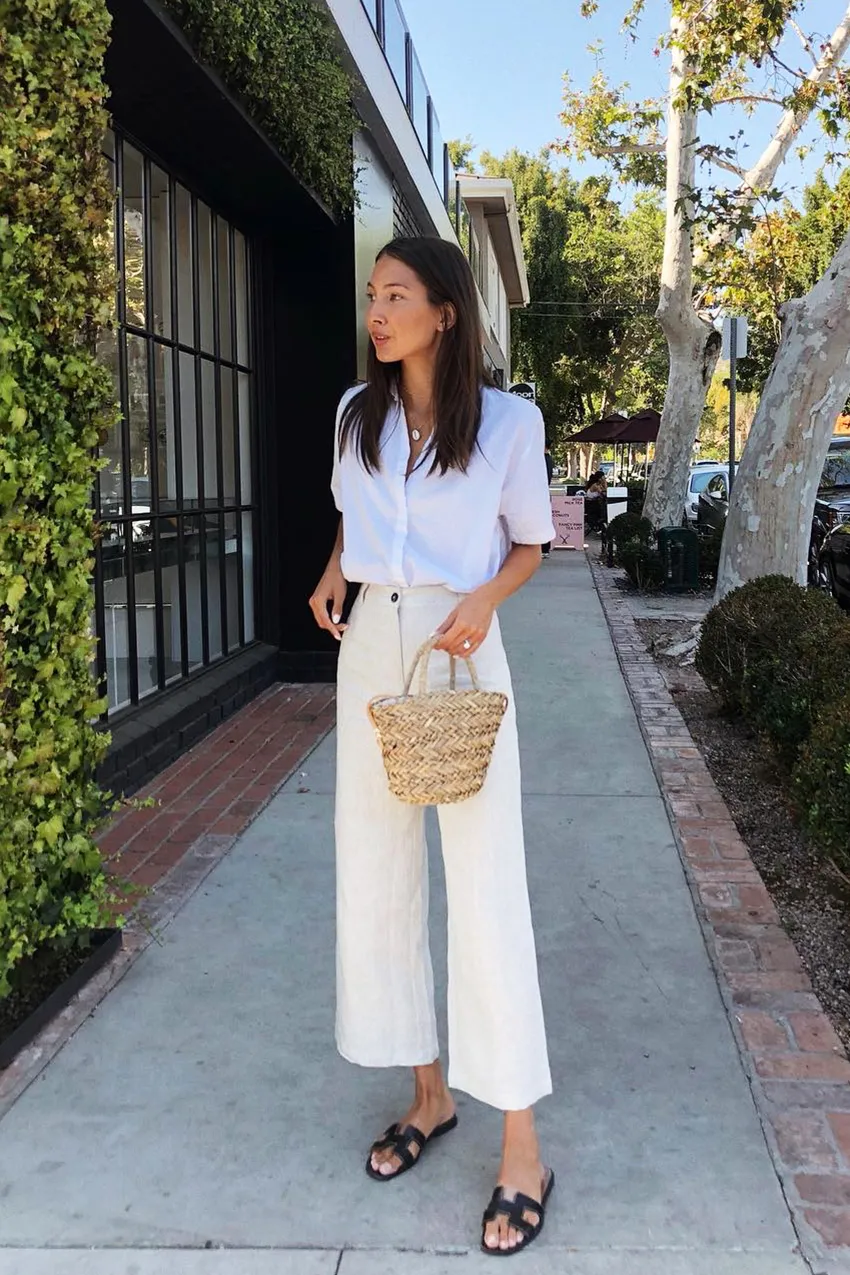 Casual summer outfit with white culottes a button-up shirt and black Hermes oran sandals