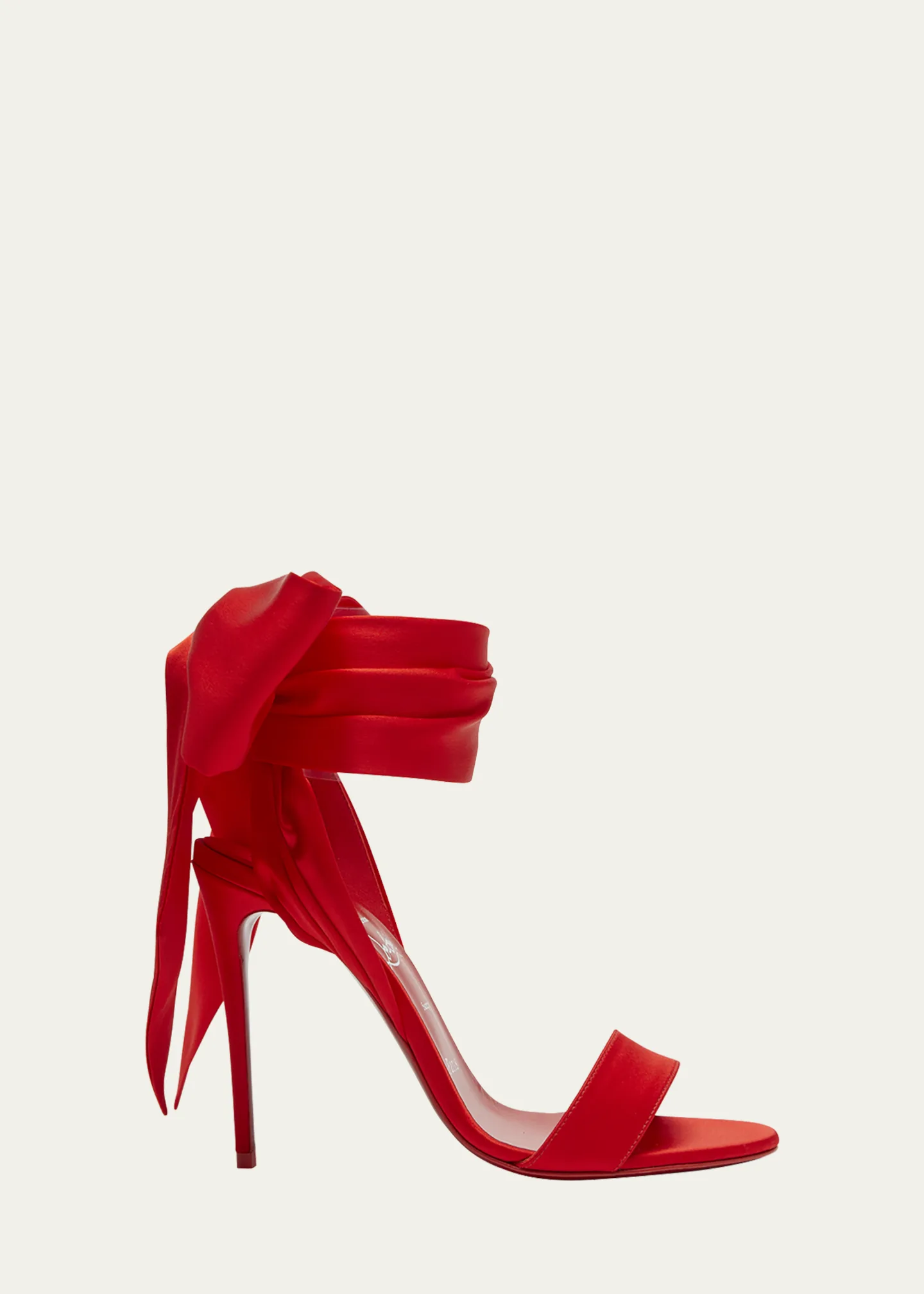 Red Louboutin lace-up heels