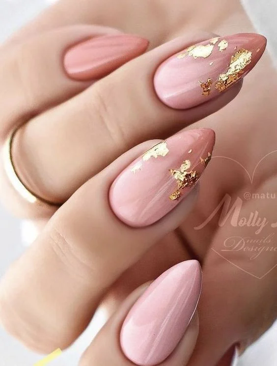 Pink ombre nails with gold foil.