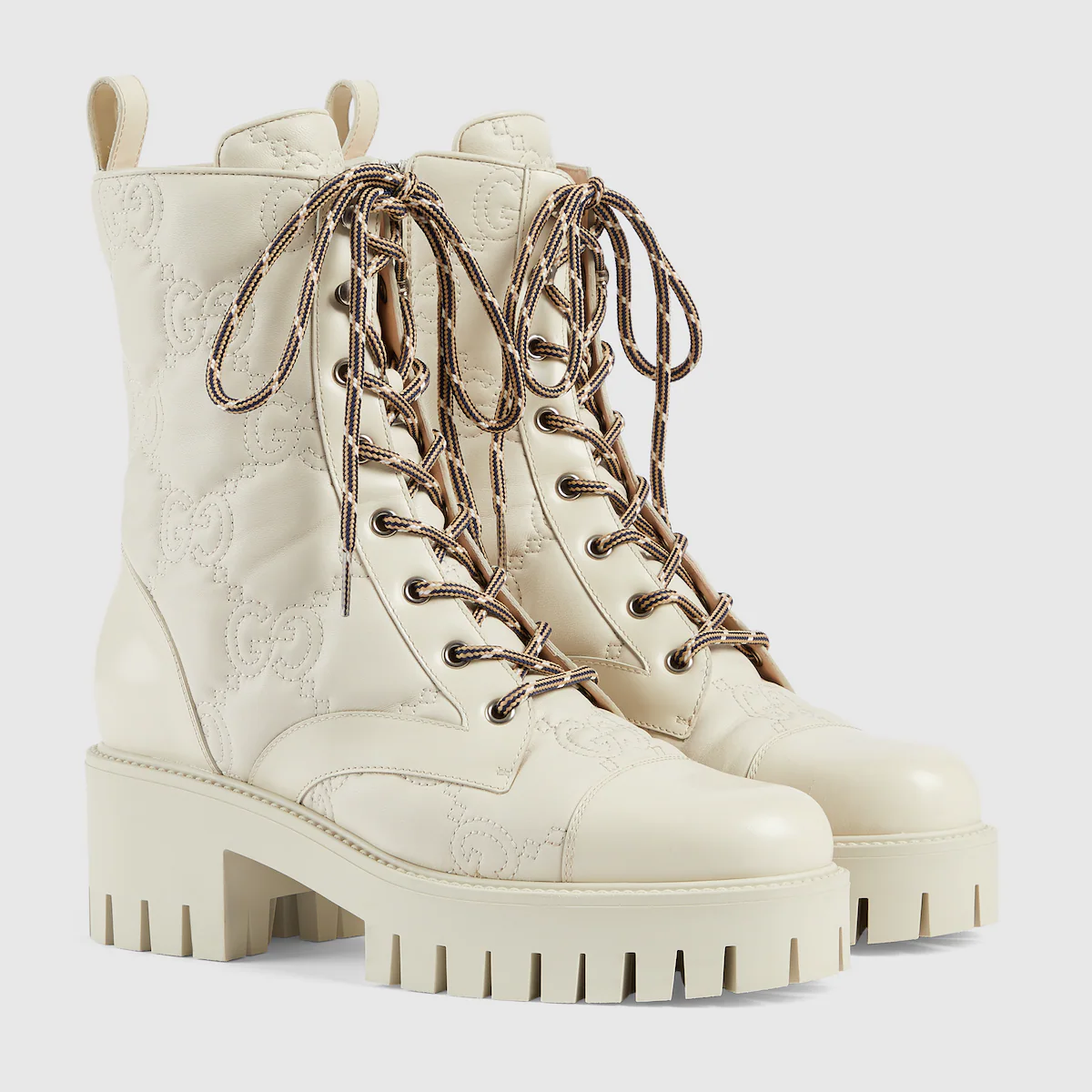 White Gucci lace-up boots.