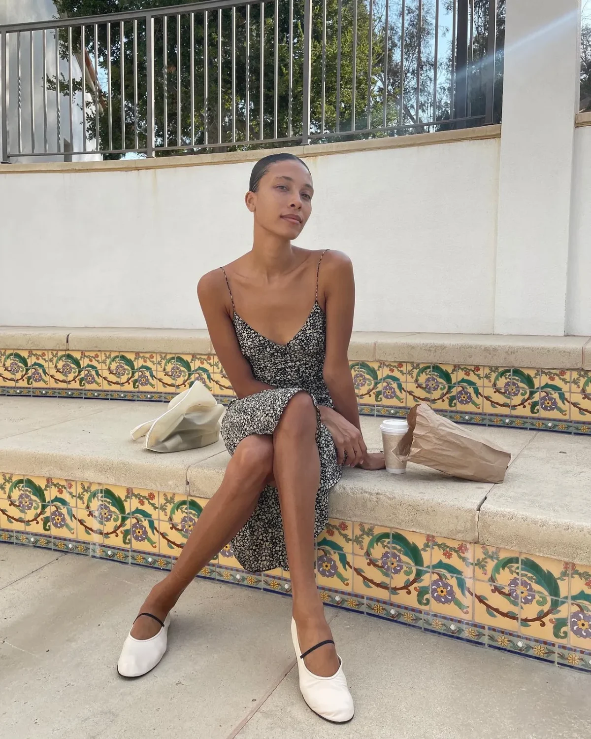 Chic floral midi dress with white ballet flats